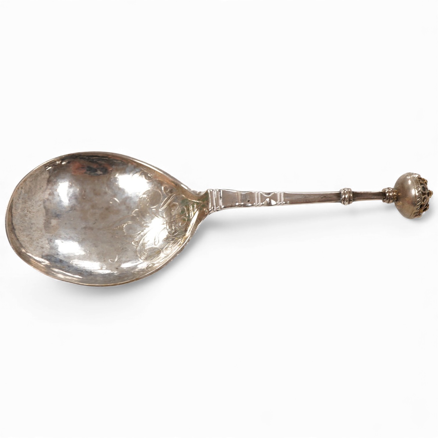 A late 18th/early 19th century Swedish? white metal spoon, with pierced parcel gilt finial, indistinct marks on the stem, 15cm.